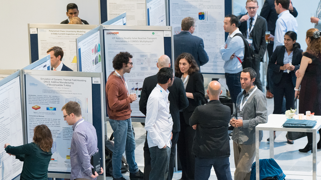 Teilnehmer der COMSOL Conference während der Poster-Session in der Ausstellungshalle.